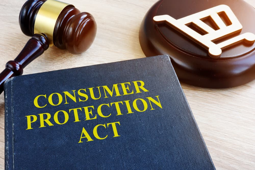 Image of a gavel on a table representing consumer protection act and legal justice.